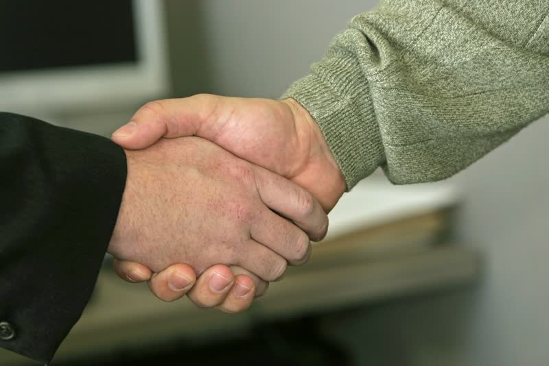 Two people shaking hands